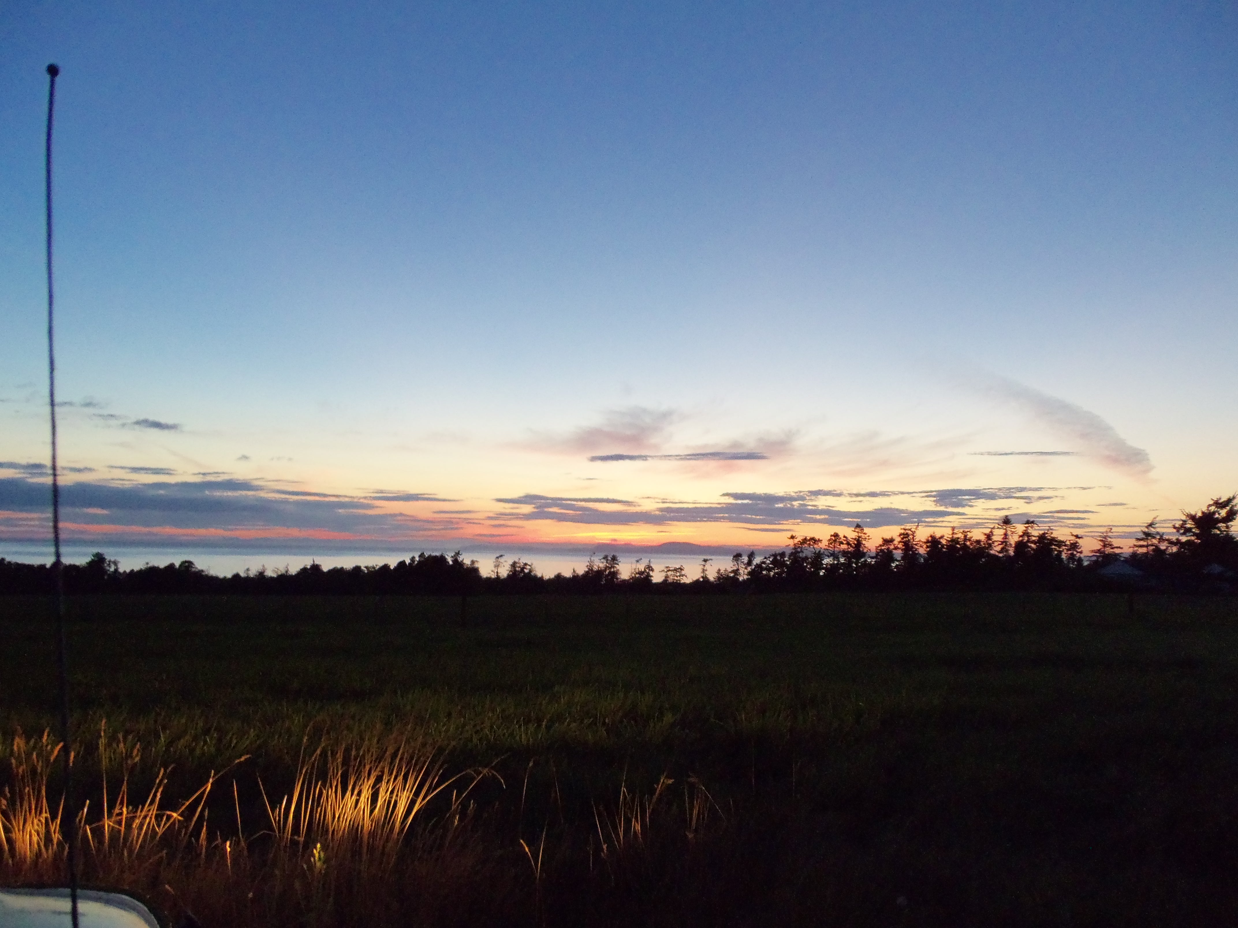 A quiet sunset above an open field